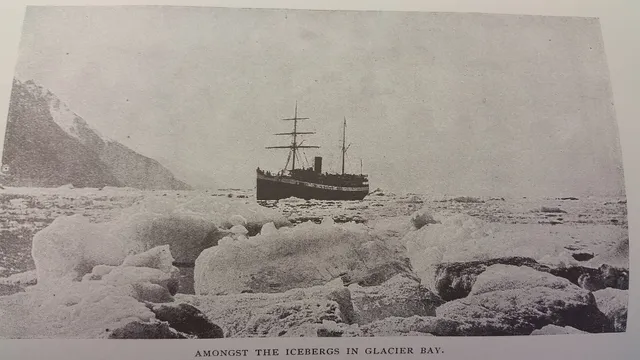 A cruise ship approaching a tidewater glacier in Alaska