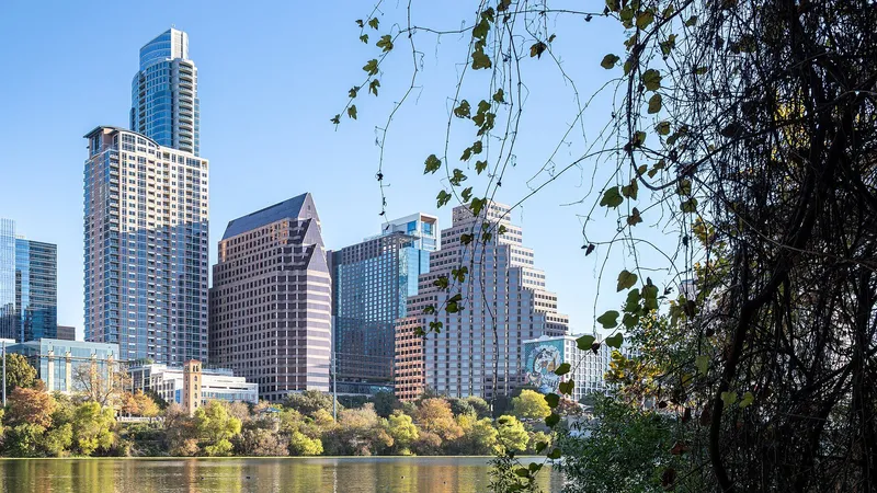 The Austin skyline reflected in Lady Bird Lake at dusk