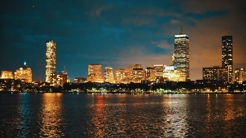 The Boston skyline across the Charles River with Back Bay brownstones in the foreground