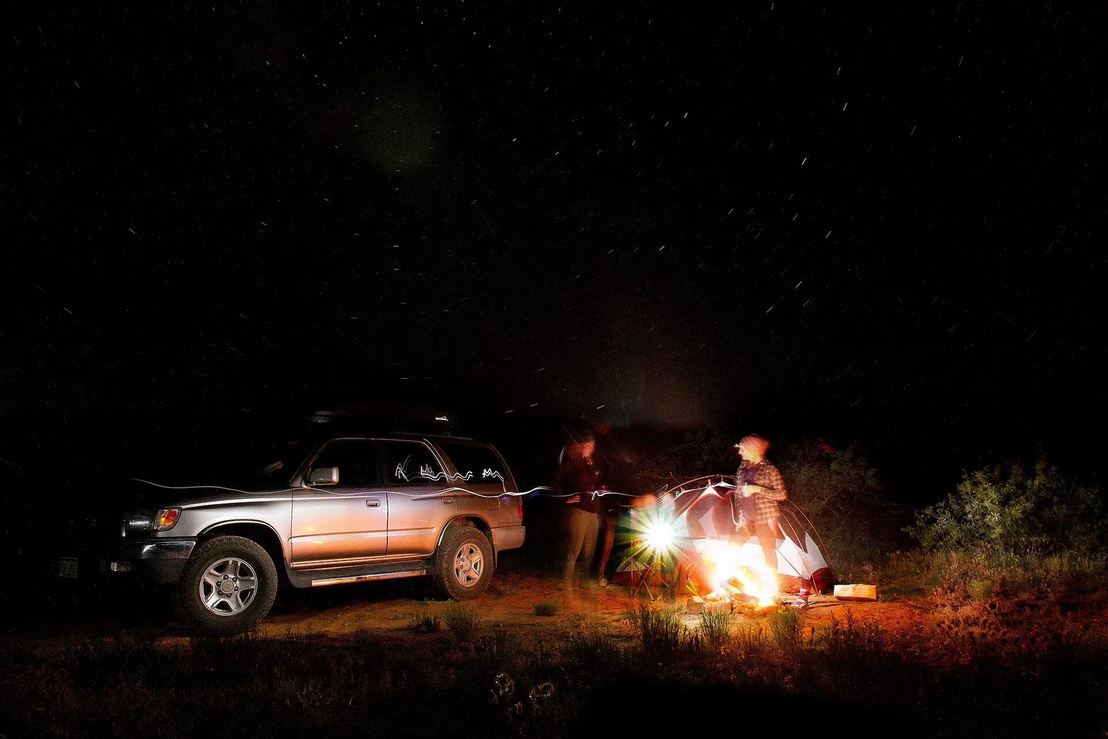 Tent glowing under the stars at an American campground