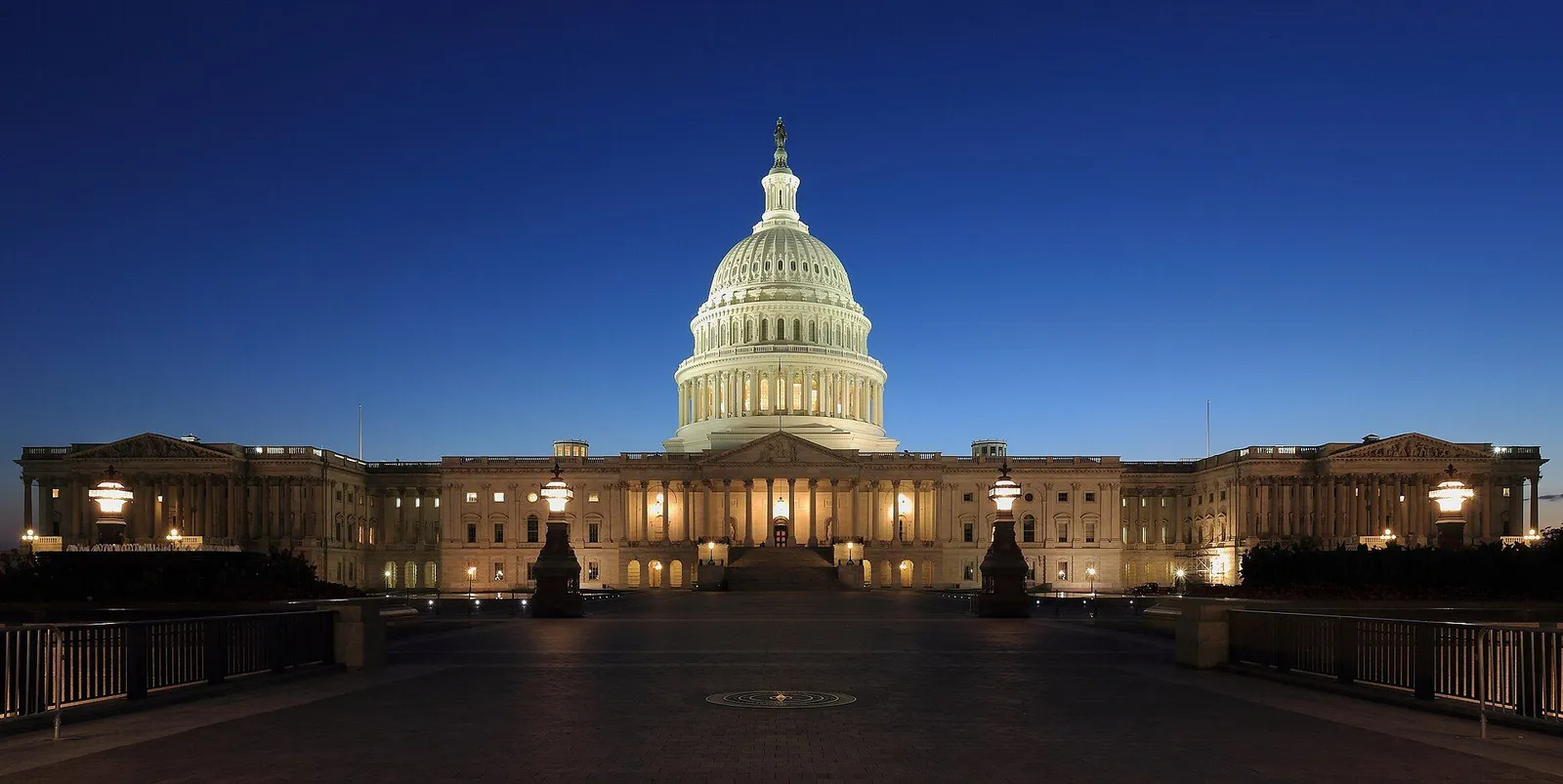 The United States Capitol dome above the National Mall in Washington DC on a clear afternoon
