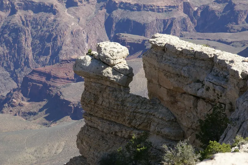 Layered red and orange canyon walls below the South Rim near Mather Point