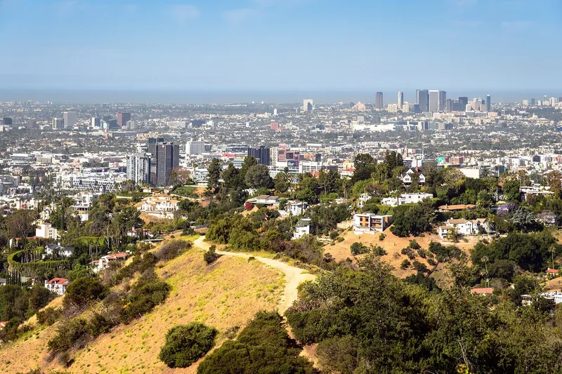 The Los Angeles skyline beneath the Hollywood Hills on a clear day