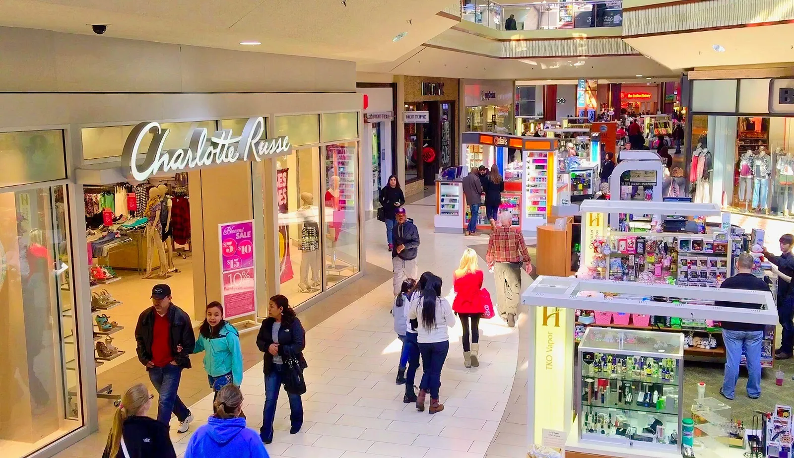 Shopping bags and storefronts at an American mall