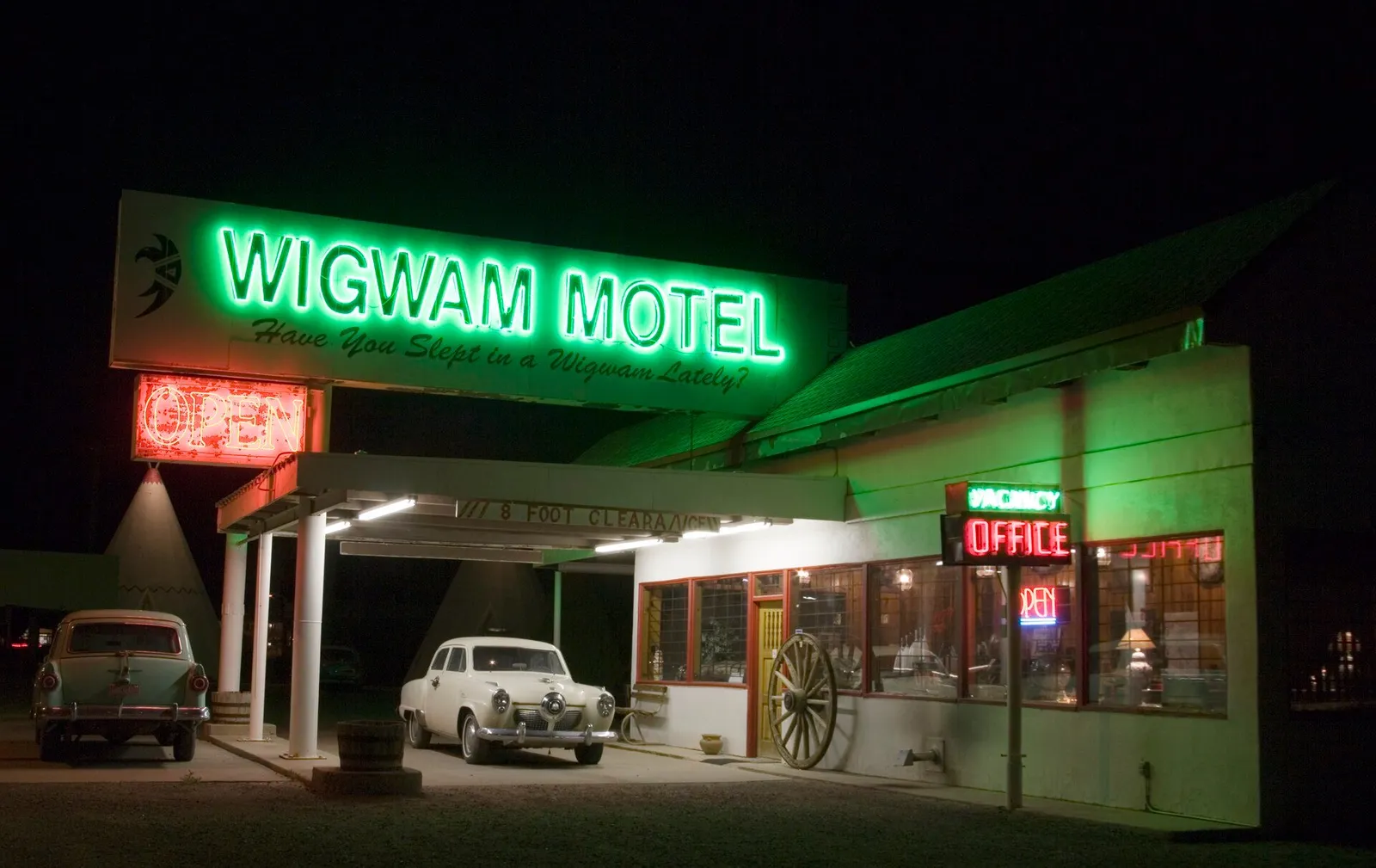 Neon sign of a classic American roadside motel at dusk